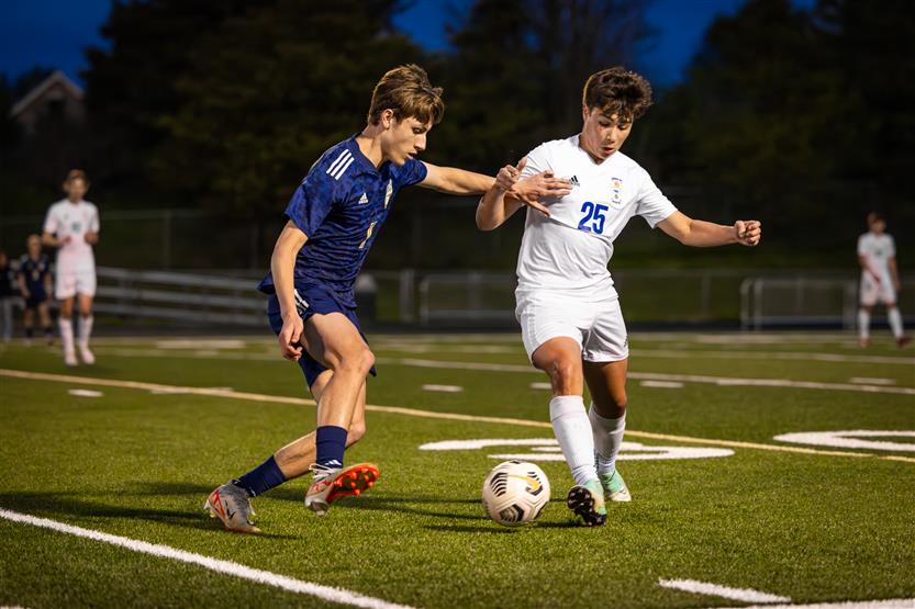 Students play soccer